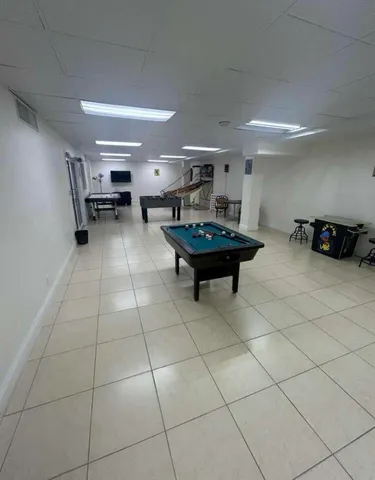 a room with furniture and a view of living room