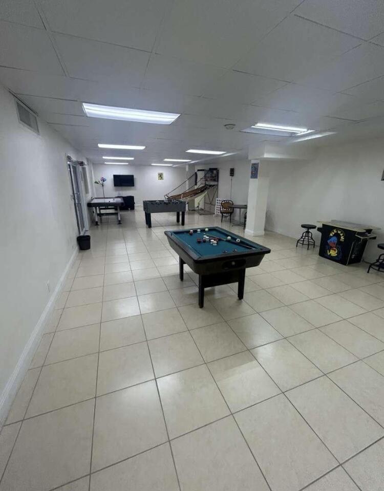 111 Briny Avenue, Unit 703 Pompano Beach, FL 33062 - Photo 16 of 19 a room with furniture and a view of living room