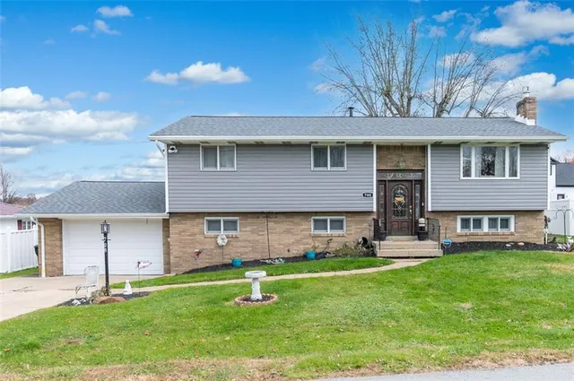 front view of a house with a yard