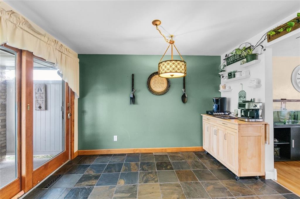 708 Hancock Street Perryopolis, PA 15473 - Photo 11 of 36 a kitchen with stainless steel appliances granite countertop a sink and a black refrigerator