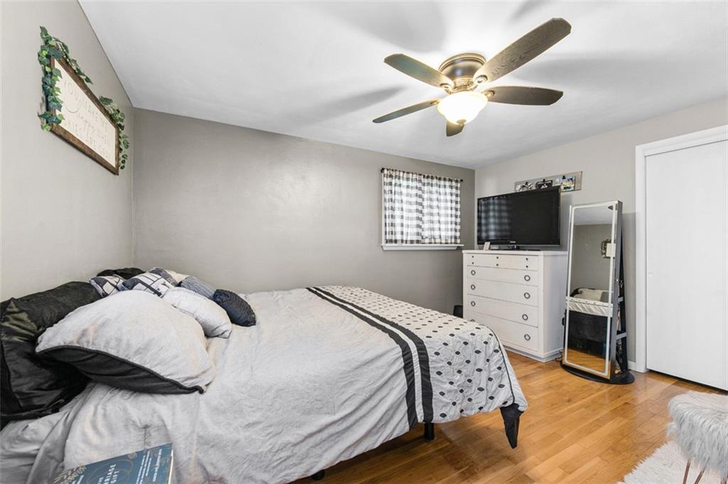 708 Hancock Street Perryopolis, PA 15473 - Photo 15 of 36 a bedroom with a bed and a flat screen tv