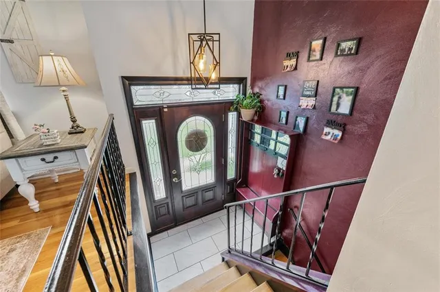 a view of an entryway with wooden floor