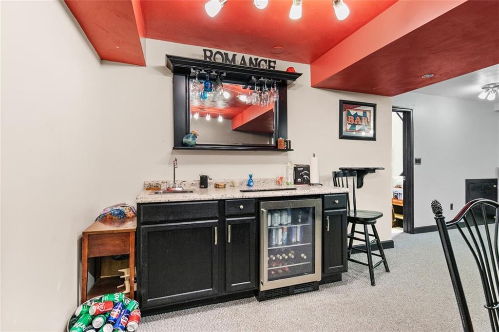 708 Hancock Street Perryopolis, PA 15473 - Photo 24 of 36 a living room with furniture and a flat screen tv