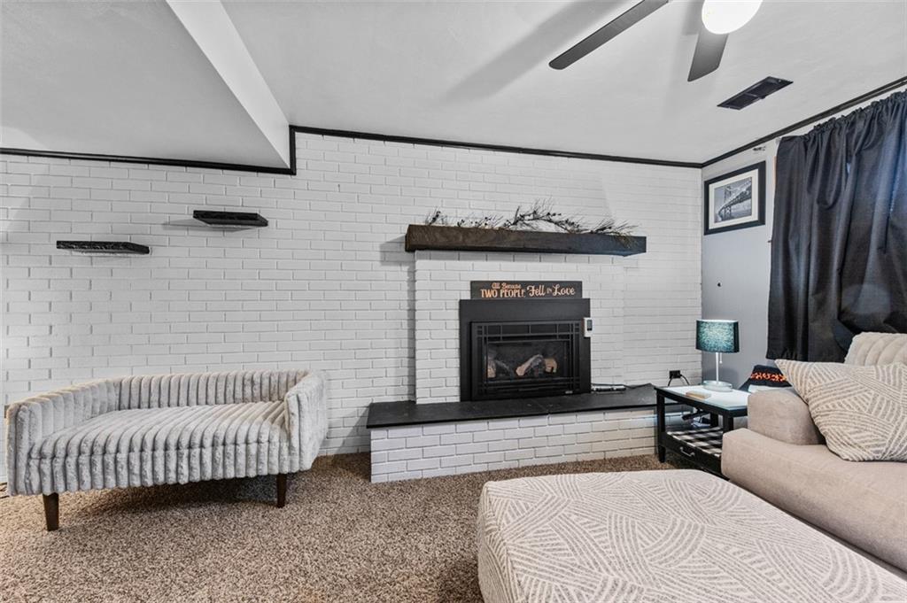 708 Hancock Street Perryopolis, PA 15473 - Photo 26 of 36 a living room with furniture and a fireplace