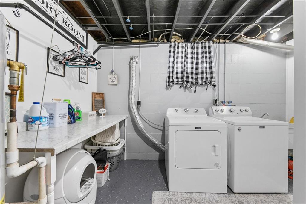 708 Hancock Street Perryopolis, PA 15473 - Photo 29 of 36 a utility room with dryer and washer
