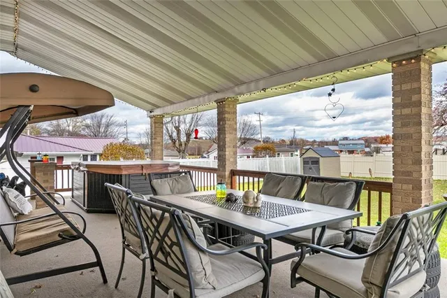 a view of a balcony with furniture