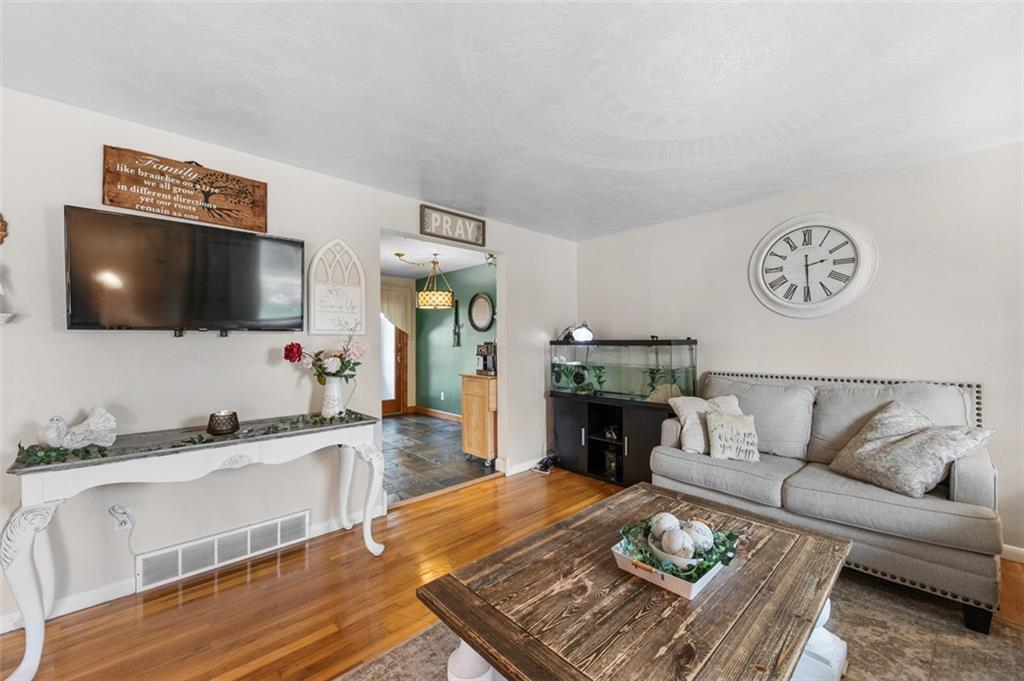 708 Hancock Street Perryopolis, PA 15473 - Photo 6 of 36 a living room with furniture and a flat screen tv