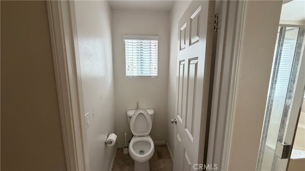 7134 Cumberland Place Rancho Cucamonga, CA 91739 - Photo 15 of 22 a bathroom with a mirror and a window