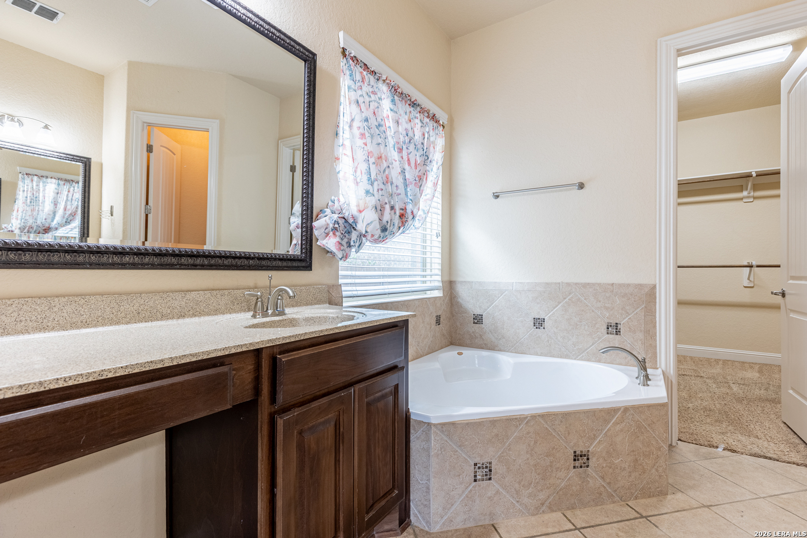8103 Mystic Chase Boerne, TX 78015 - Photo 25 of 49 a bathroom with a bathtub and a sink
