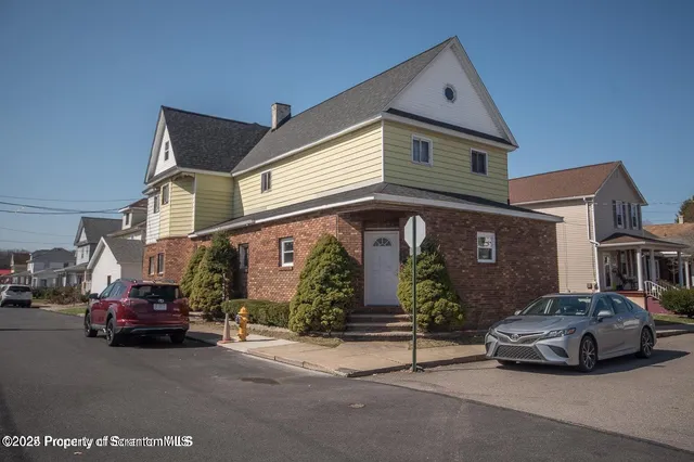 a car parked in front of a house