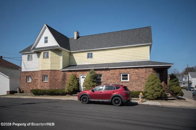 a car parked in front of a house