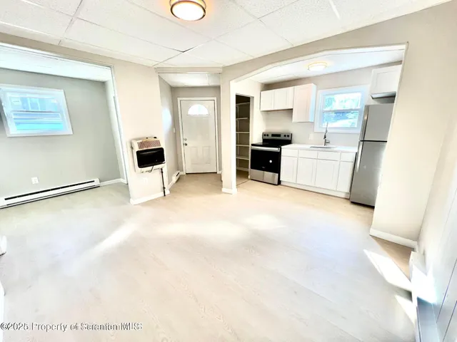 a view of a kitchen with a sink