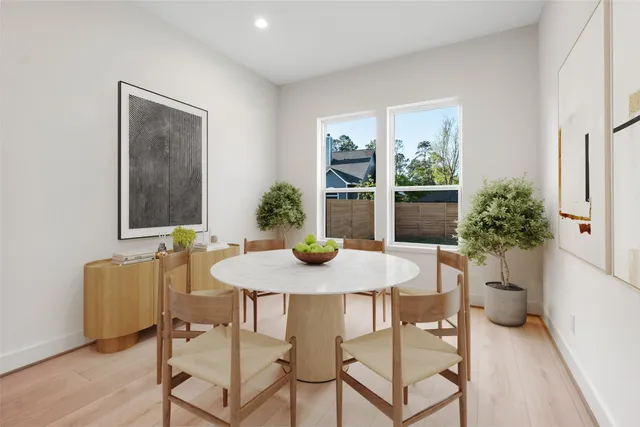 a view of a dining room with furniture and window
