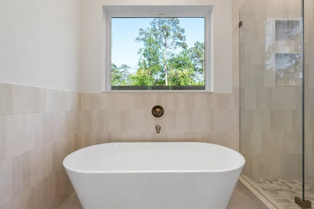 a white bath tub sitting in a bathroom