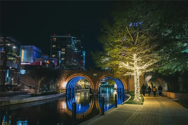 a view of swimming pool with outdoor seating and covered with trees