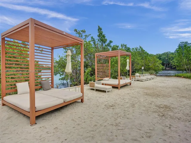 a bedroom with a bed and large window