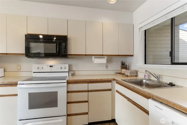 a kitchen with a sink and cabinets