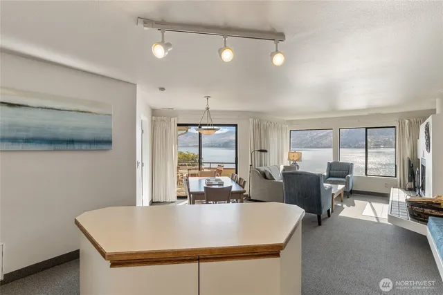 a large white kitchen with a large window