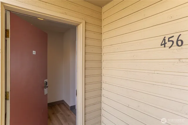 a view of a backyard with chairs and a fire pit