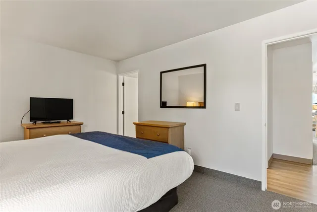 a bedroom with a bed and a cabinets