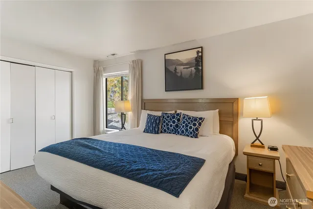 a bathroom with a sink toilet vanity and shower