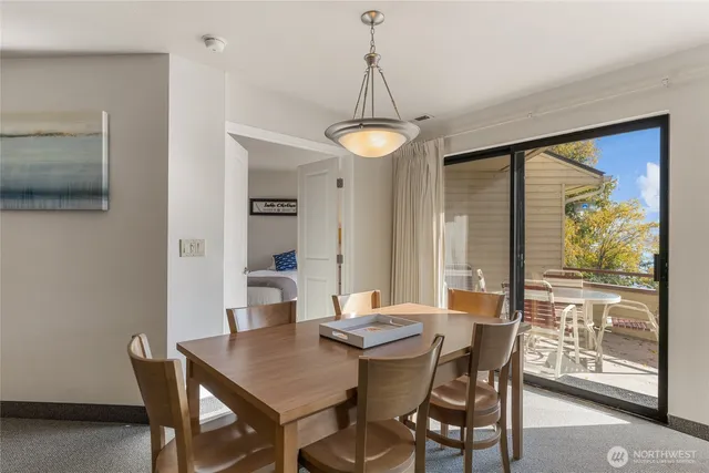 a view of a dining room with furniture window and outside view
