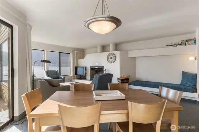 a living room with furniture a rug and a chandelier