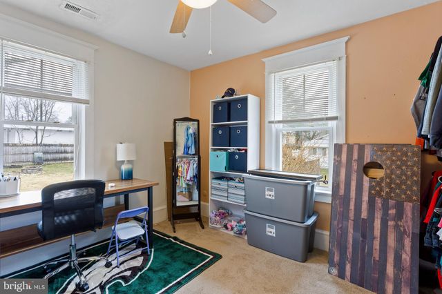 a view of a livingroom with furniture and a window