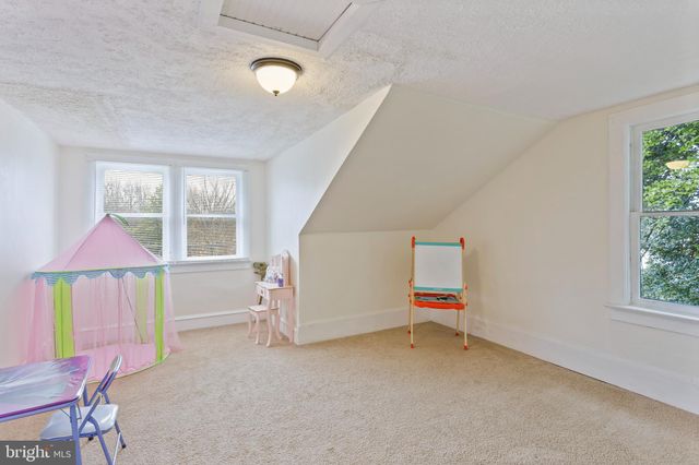 a room with furniture and window