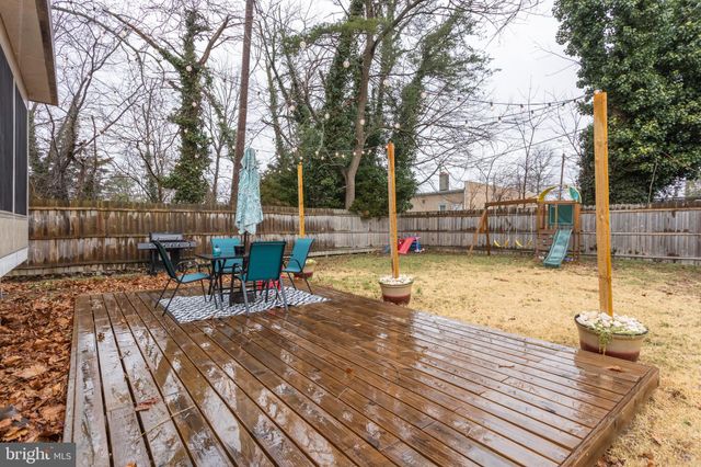 a view of a backyard with sitting area