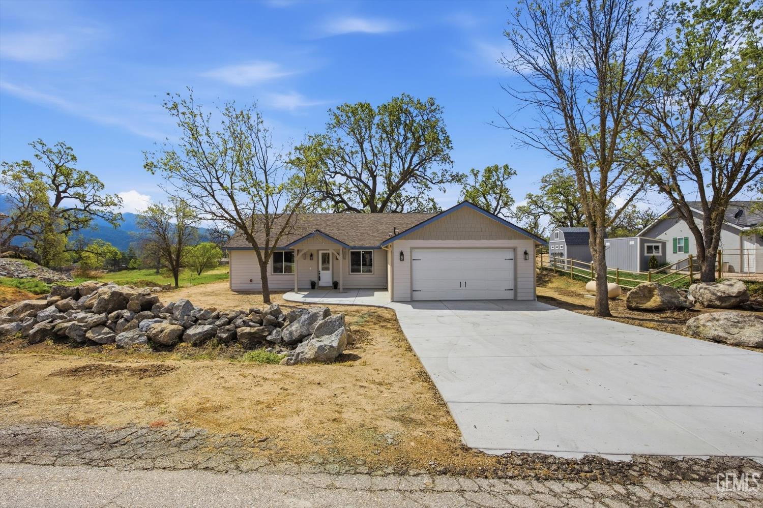 Undisclosed Address Tehachapi, CA 93561 - Photo 10 of 47 a front view of a house with a yard