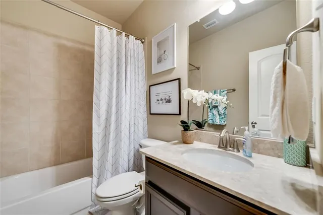 a large kitchen with a table and chairs