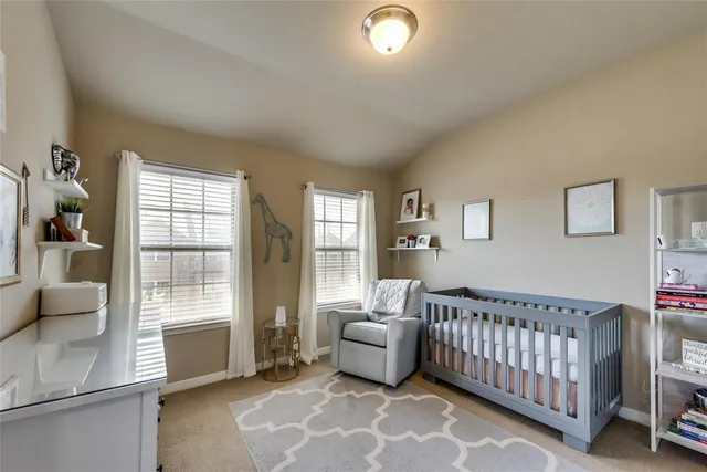 a kitchen with granite countertop a sink a counter space appliances and cabinets