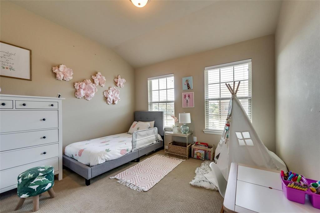 3943 Asbury Lane Addison, TX 75001 - Photo 18 of 29 a bedroom with a bed and wooden floor
