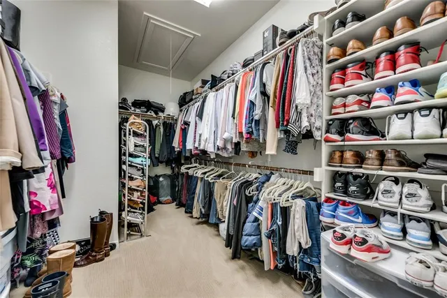 a bathroom with a bathtub double vanity sink and a mirror