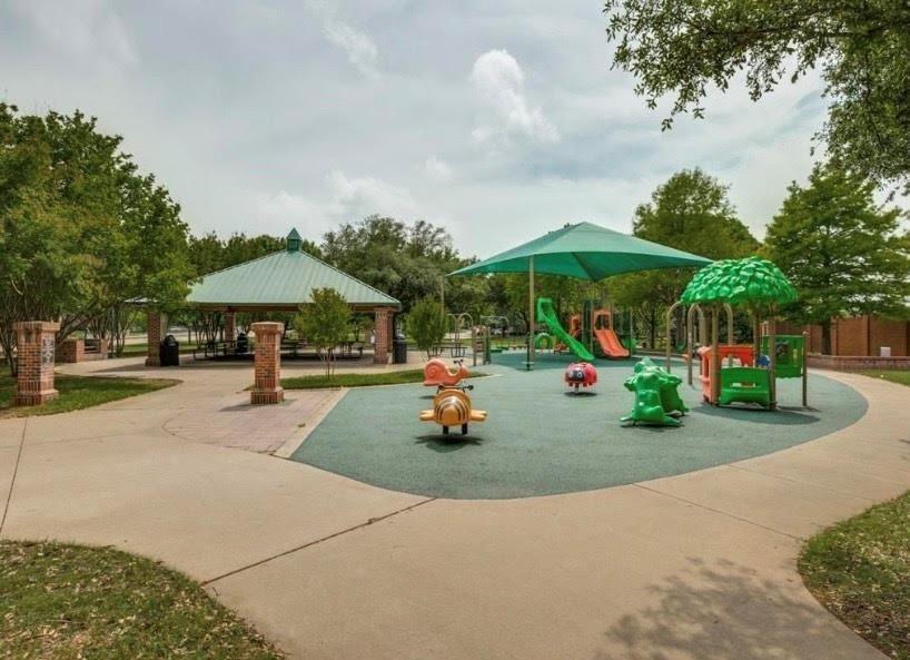 3943 Asbury Lane Addison, TX 75001 - Photo 25 of 29 a childrens park with lots of swings and slides