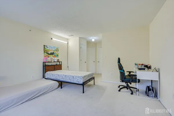 a living room with furniture and a piano
