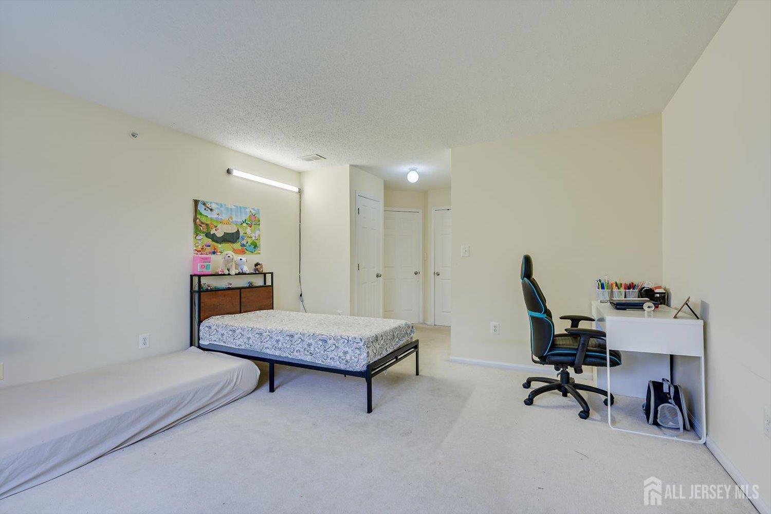 27 Edinburgh Court Edison, NJ 08820 - Photo 13 of 15 a living room with furniture and a piano