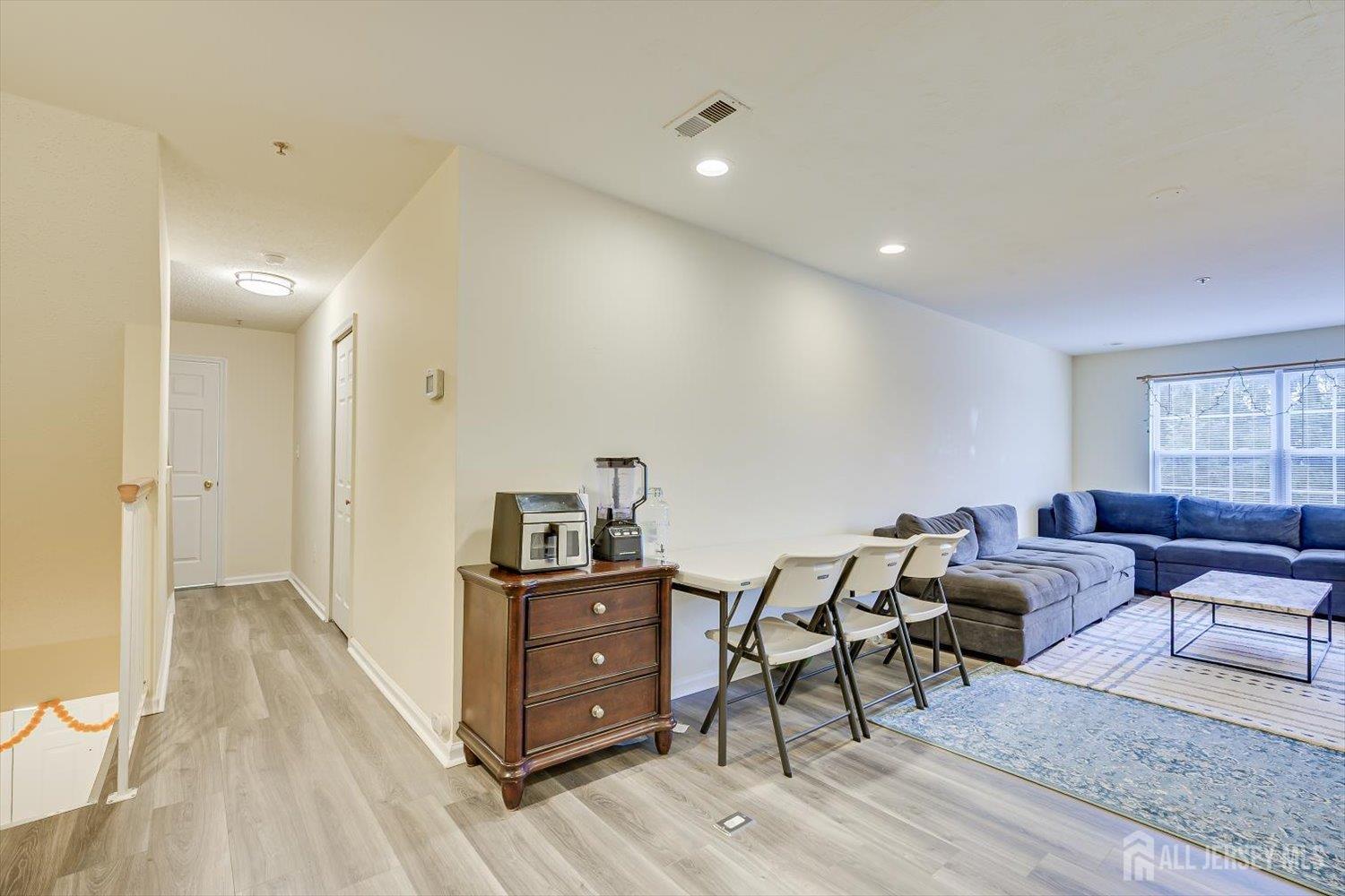 27 Edinburgh Court Edison, NJ 08820 - Photo 8 of 15 a living room with furniture and wooden floor