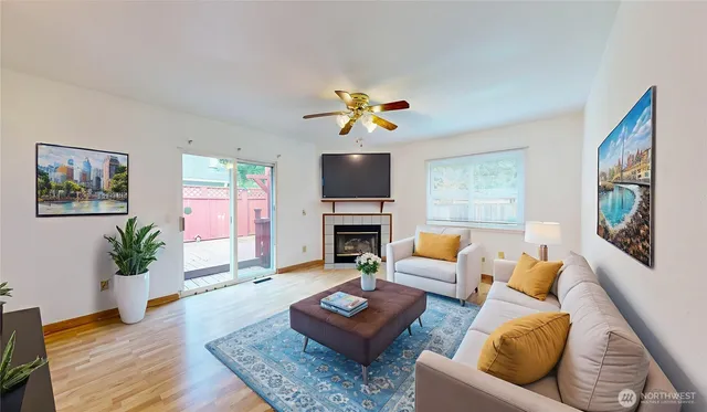 a living room with furniture fireplace and a flat screen tv