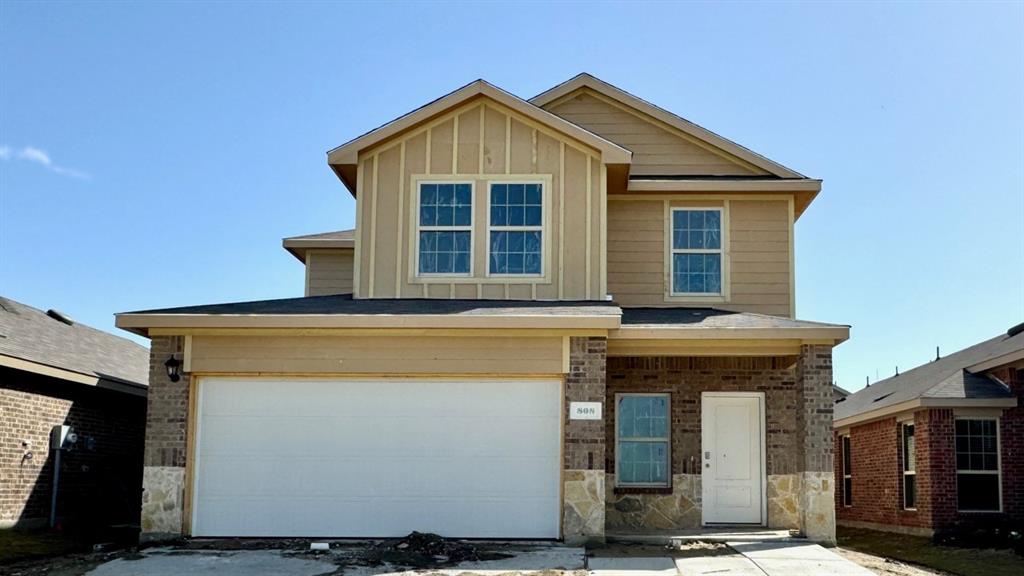 a front view of a house with a garage