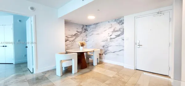 a bathroom with a shower and a sink