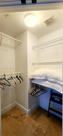 a view of a room with racks on the wall