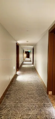 wooden floor in an empty room with a fireplace
