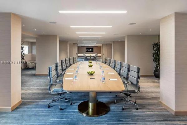 a view of a swimming pool and dining room