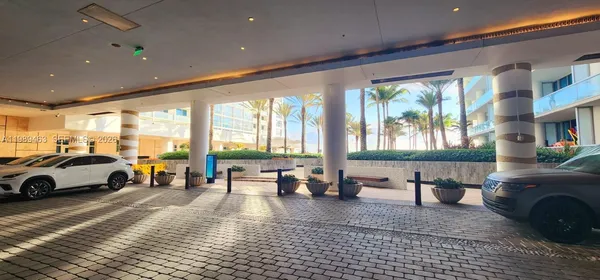 a living room with furniture window and wooden floor