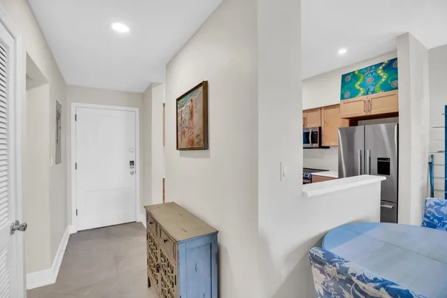 a view of kitchen and hall with wooden floor