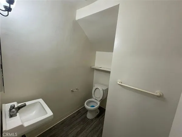 a bathroom with a toilet and a sink