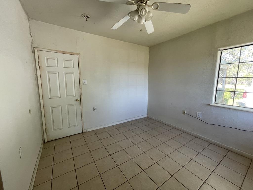 2385 Lakeview Loop Stonyford, CA 95979 - Photo 11 of 20 an empty room with chandelier fan and window