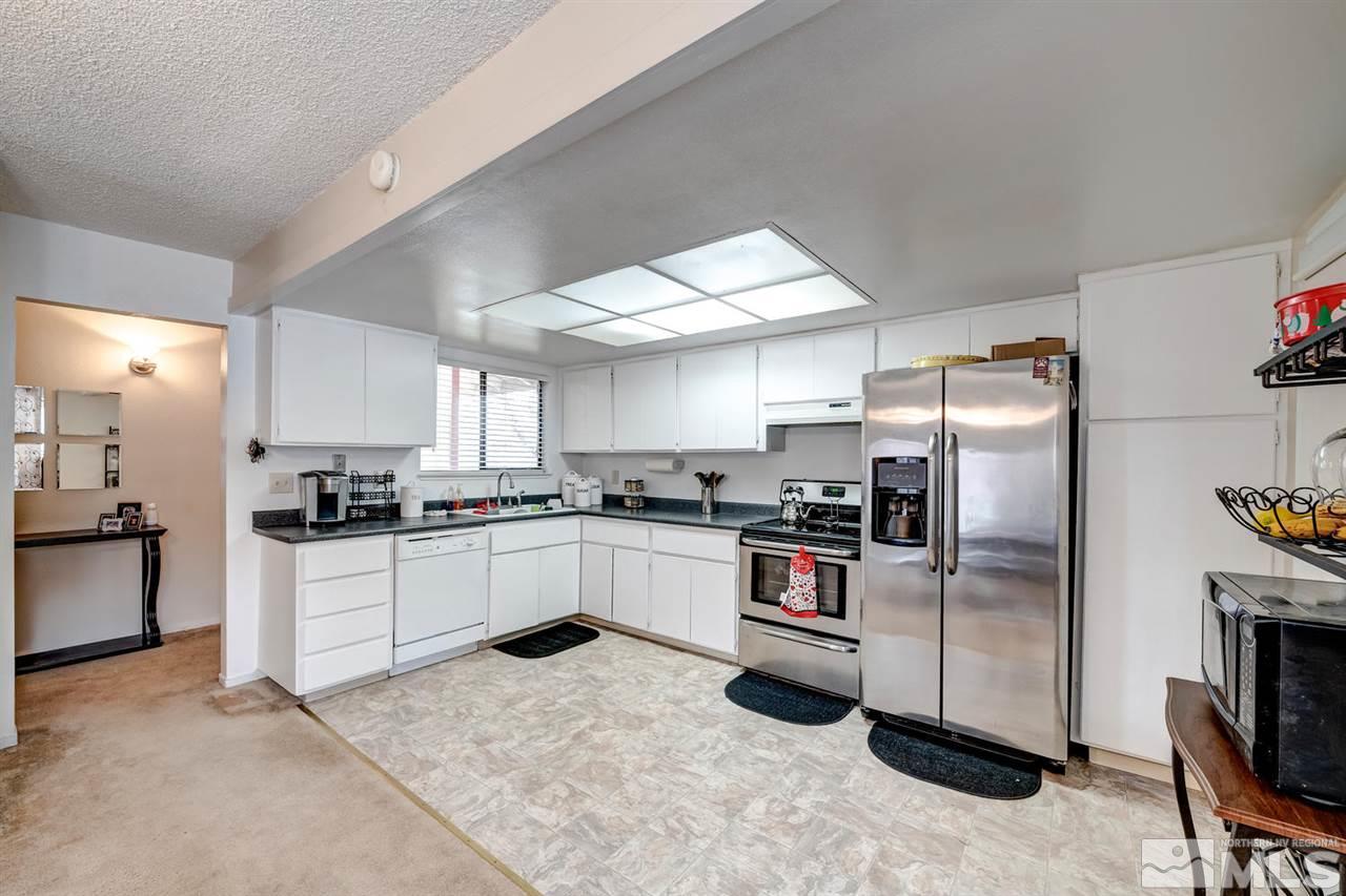 3315 Bowie Road Reno, NV 89503 - Photo 6 of 35 a kitchen with cabinets and stainless steel appliances